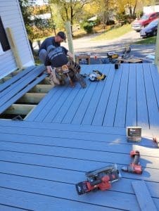 A worker building a new deck.