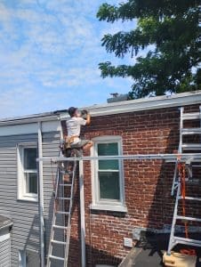 A man working on a roof.